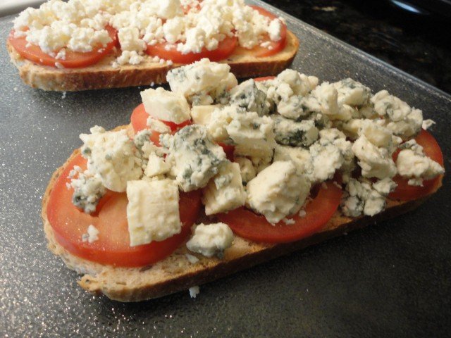 Crumbled Cheese with Sliced Tomatoes on Toasted Bread Preparing an Open Face Sandwich